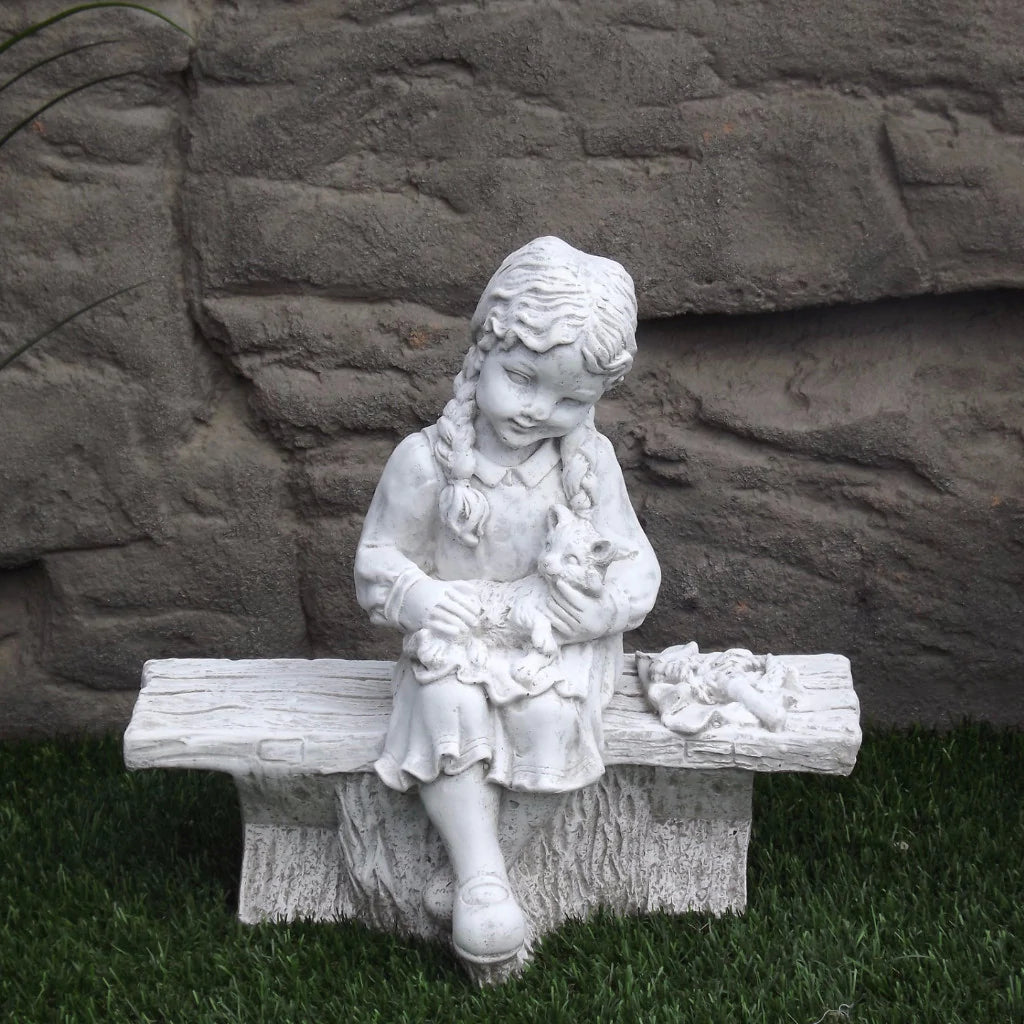 Photo of Small Girl on Bench with Cat - Marquis Gardens