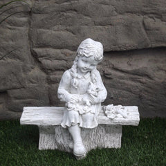 Photo of Small Girl on Bench with Cat - Marquis Gardens
