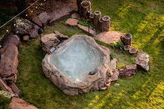 Photo of Universal Rocks Semi In-Ground Spa - Earth - Marquis Gardens