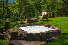 Photo of Universal Rocks Semi In-Ground Spa - Earth - Marquis Gardens